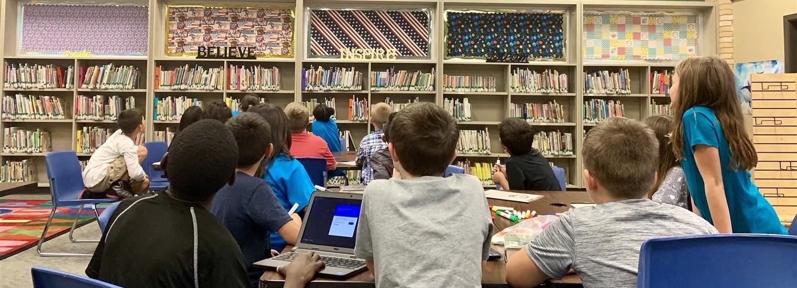 4th grade students in the library 4th grade students in the library